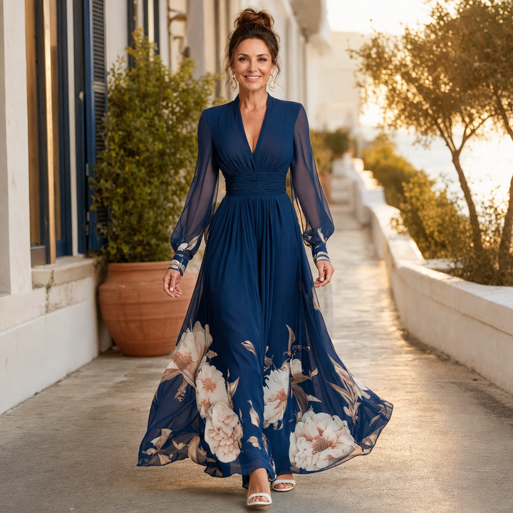 Elegant sheer long sleeves on a women's navy V-neck pleated maxi dress, highlighting delicate fabric detail.