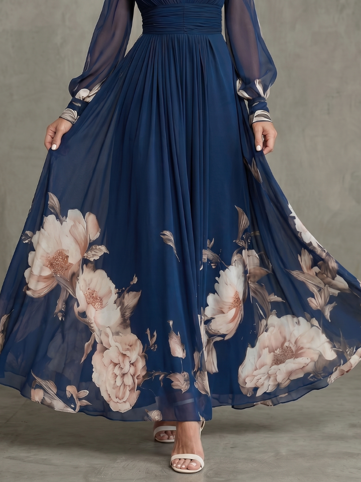 Chic back view of a women's navy V-neck pleated maxi dress with delicate sheer long sleeves, ideal for occasions.