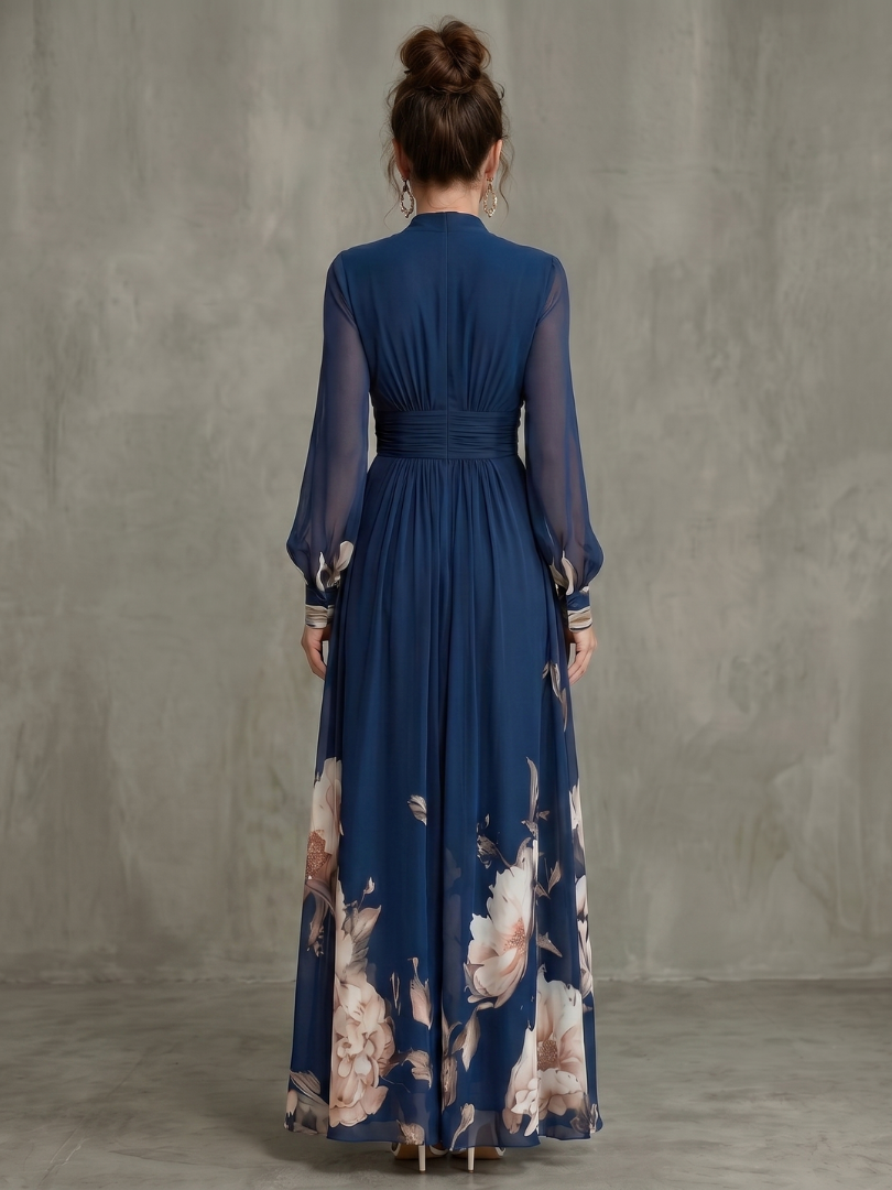 Stylish women in an elegant navy V-neck pleated maxi dress with sheer sleeves, perfect for a summer occasion.