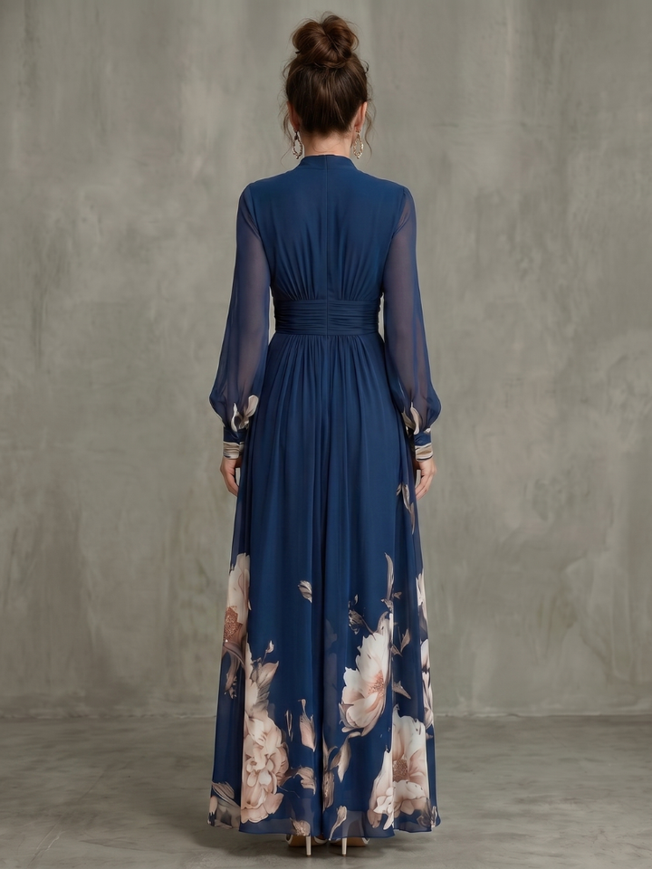 Stylish women in an elegant navy V-neck pleated maxi dress with sheer sleeves, perfect for a summer occasion.