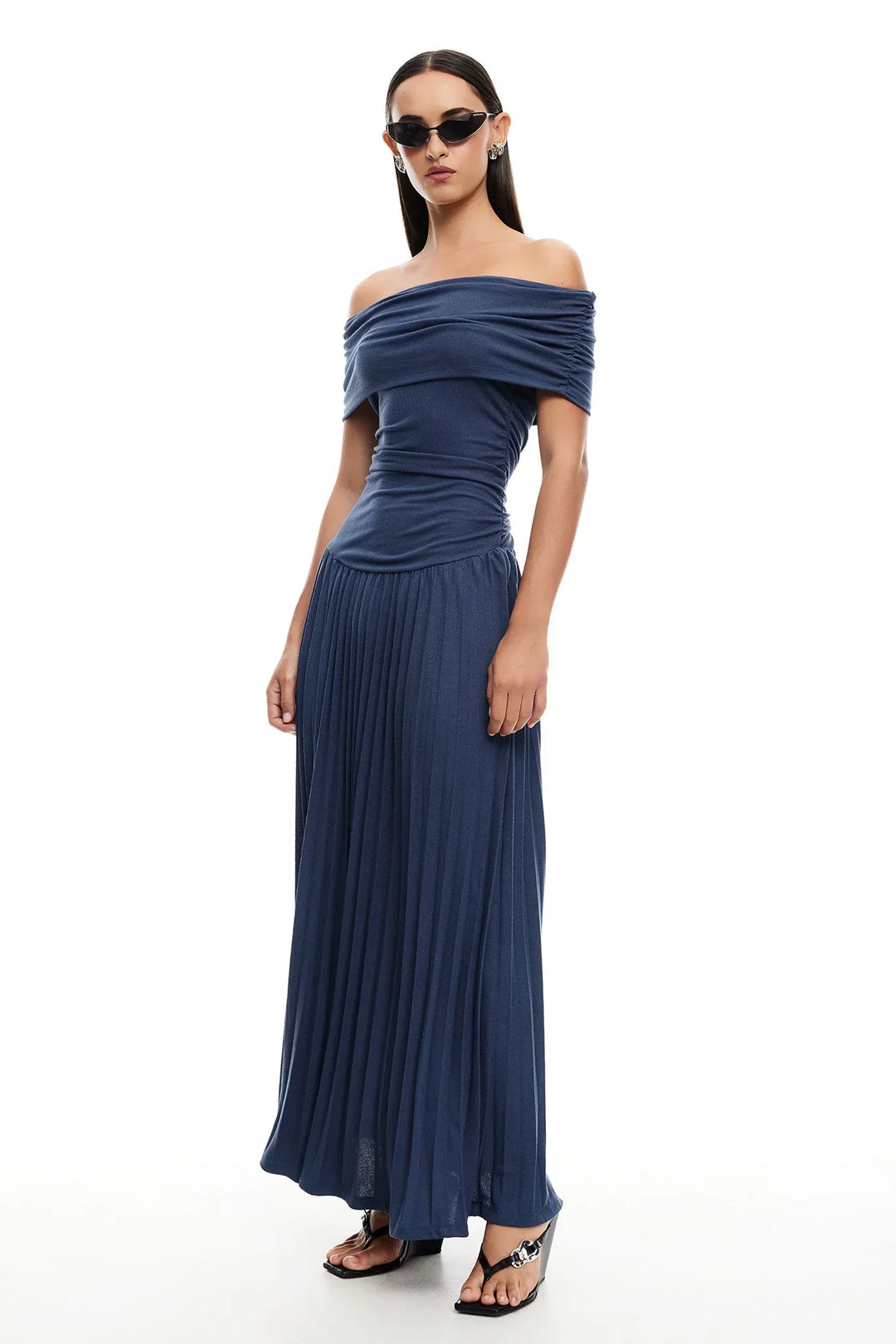 Elegant navy off-shoulder pleated maxi dress, perfect for a special evening occasion.