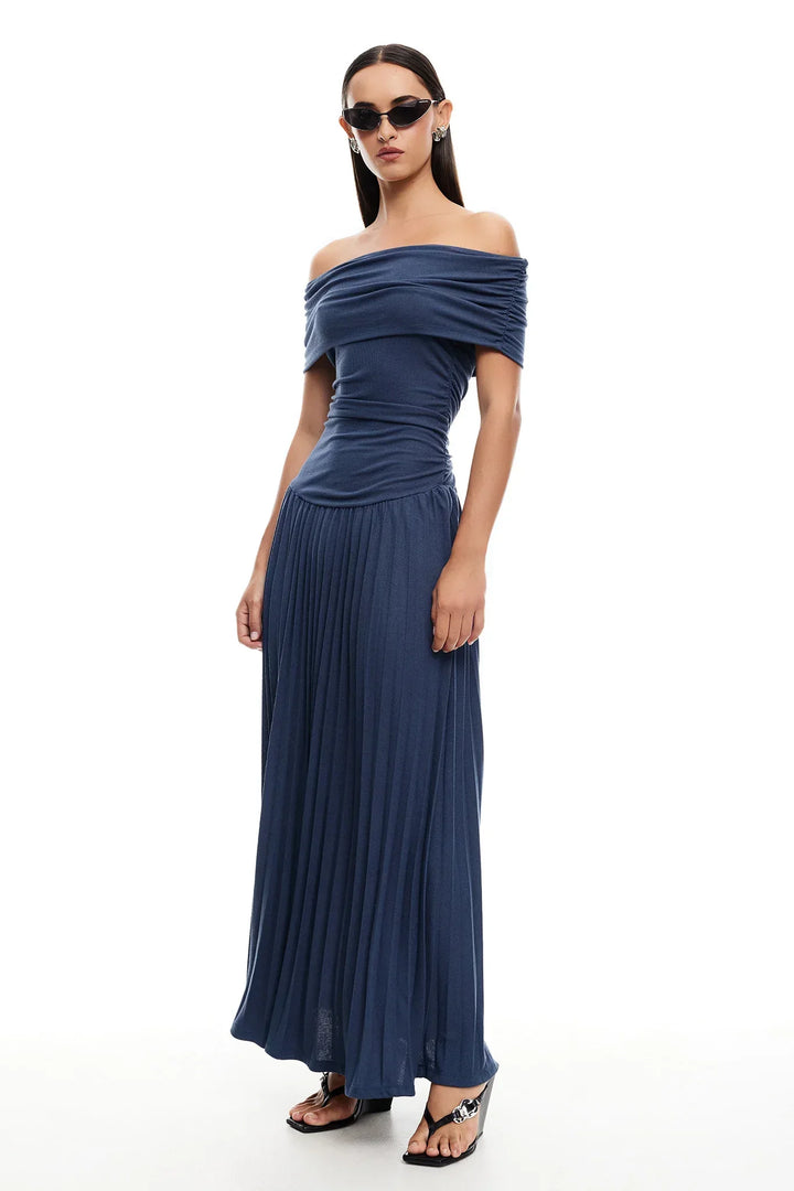 Elegant navy off-shoulder pleated maxi dress, perfect for a special evening occasion.
