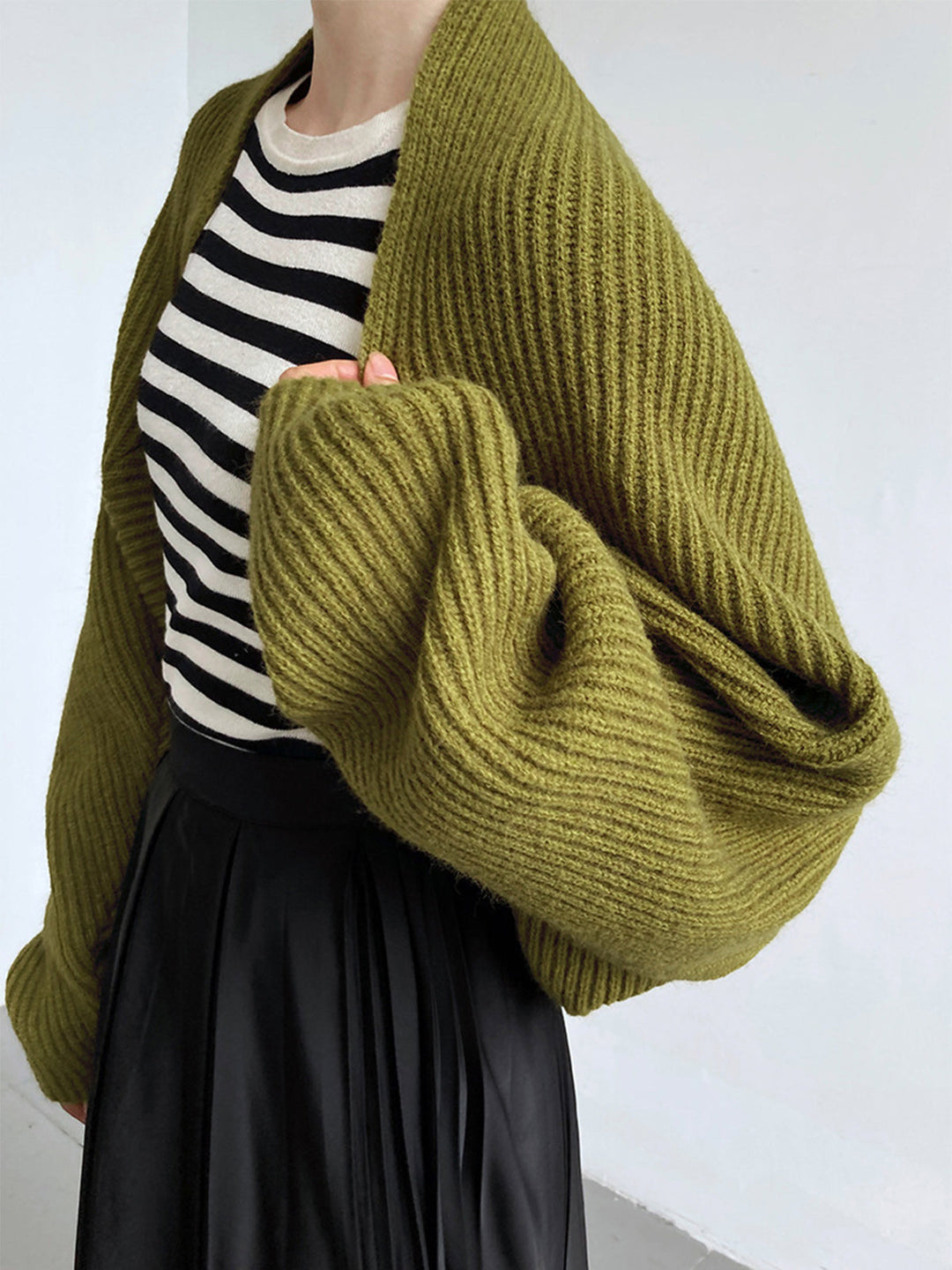 Stylish black women's shrug sweater, long sleeve open-front design. Perfect for versatile layering.