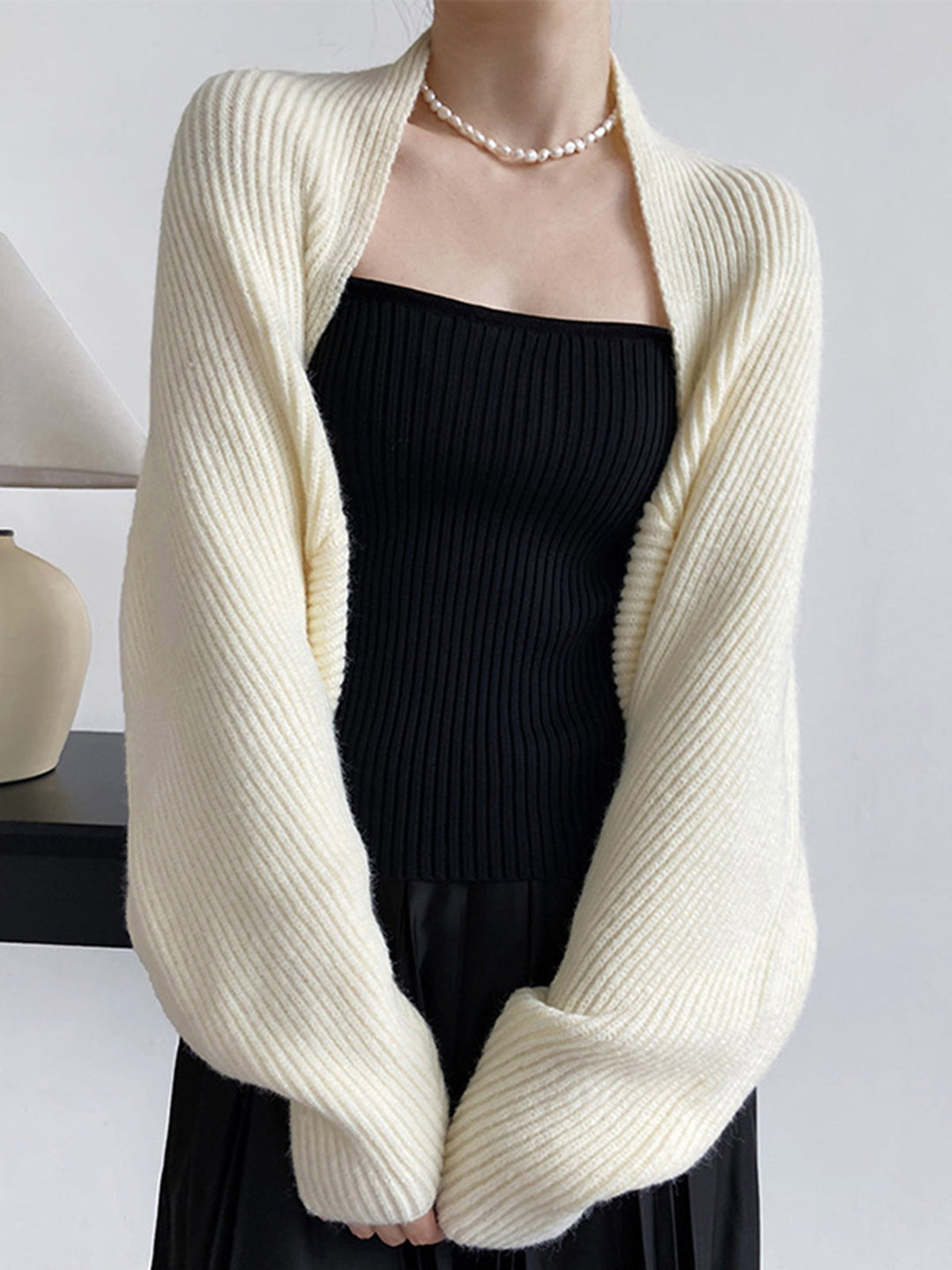 Versatile off-white long sleeve open-front shrug sweater for women. Effortless style and comfort.
