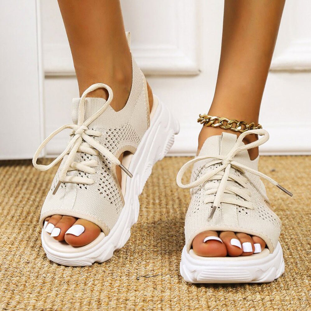 Fashionable women's platform sandals with open-toe and lace-up closure. Ideal casual summer footwear.
