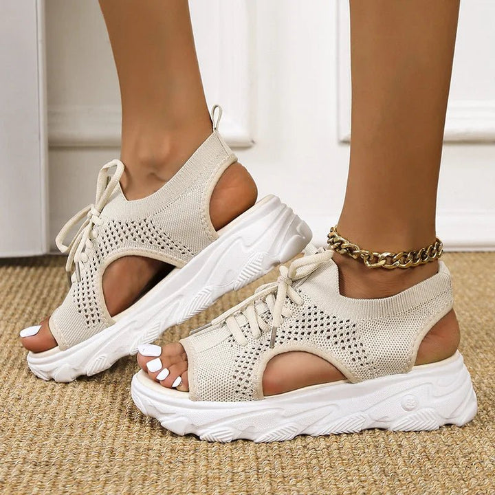 Trendy women's platform sandals with open-toe design & supportive lace-up closure. Perfect for height & style.