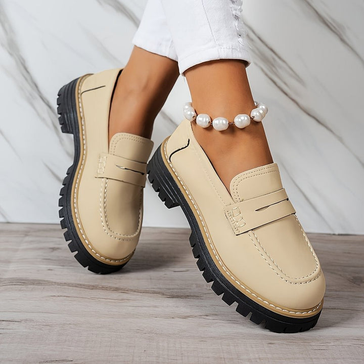 Slip-on women's casual loafers, featuring a wide toe box & orthopaedic support for foot health.