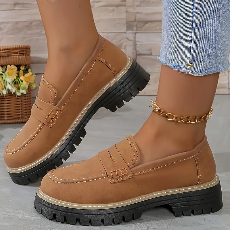 Tan comfort flats for women, providing a wide toe box for relaxed, supportive everyday wear.