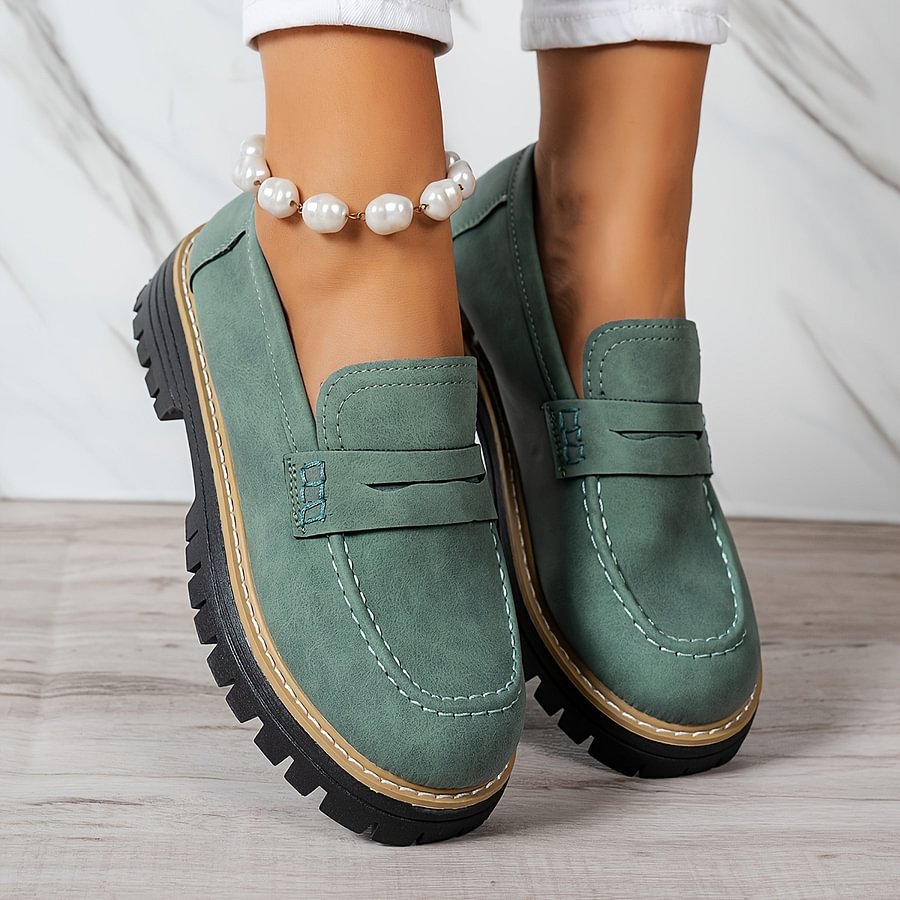 Navy comfort slip-on loafers for women, featuring a wide toe box & excellent foot support.