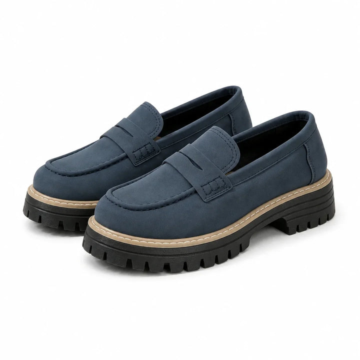 Black slip-on comfort loafers for women, featuring a wide toe box & arch support.