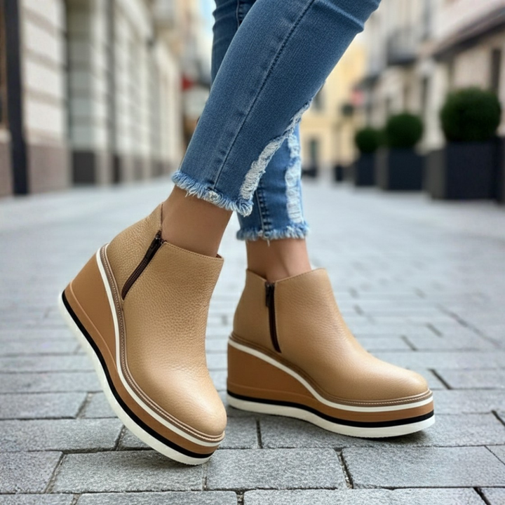 Women's stylish orthopedic ankle boots, comfortable wedge heel design for optimal support & chic winter fashion.