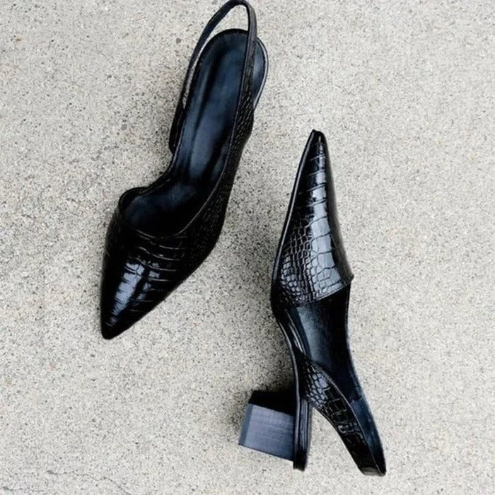 Black leather orthopedic dress pumps for women, ensuring all-day comfort and support for formal events or work attire.