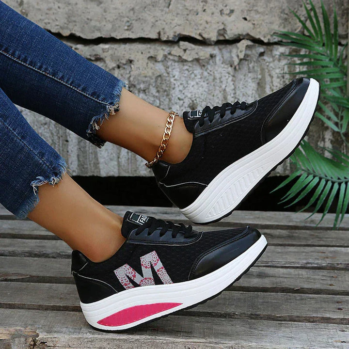 Pain-relieving women's orthopedic sneakers. Cushioned walking shoes promoting better posture & comfort.