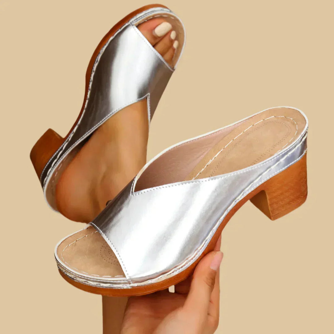 Supportive women's heeled sandal with comfortable block heel. Ideal for walking & posture alignment.