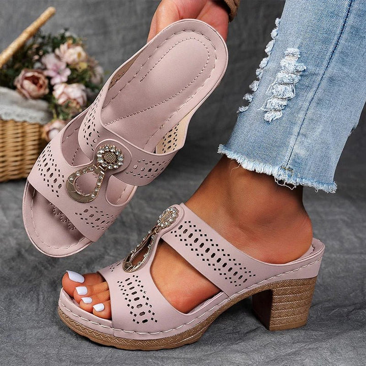 Designed for comfort, these women's orthopedic heeled sandals feature arch support & a chic look for summer.