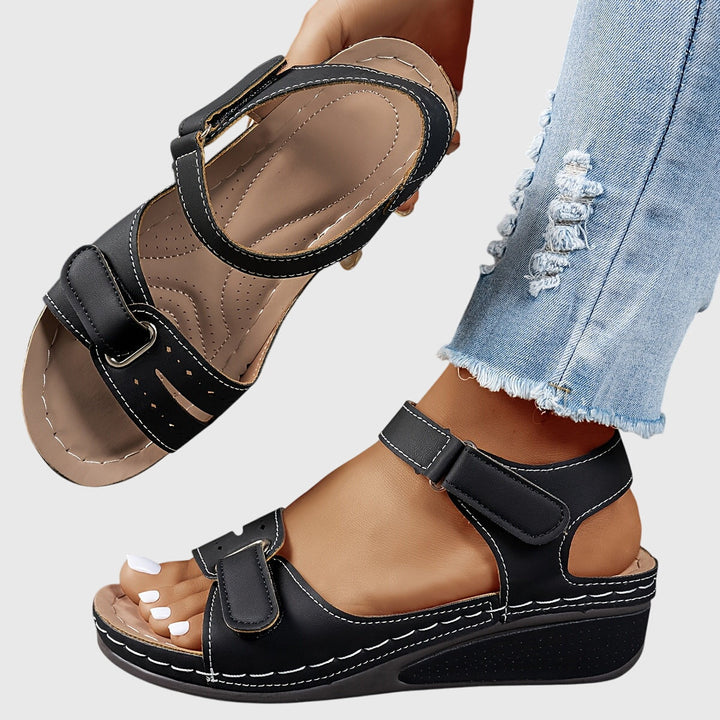 Comfortable black orthopedic platform sandals for women, with a buckle strap.