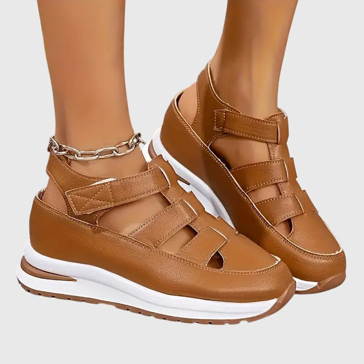 Pair of women's orthopedic sandals, ideal for daily casual wear, with arch support & adjustable comfort.
