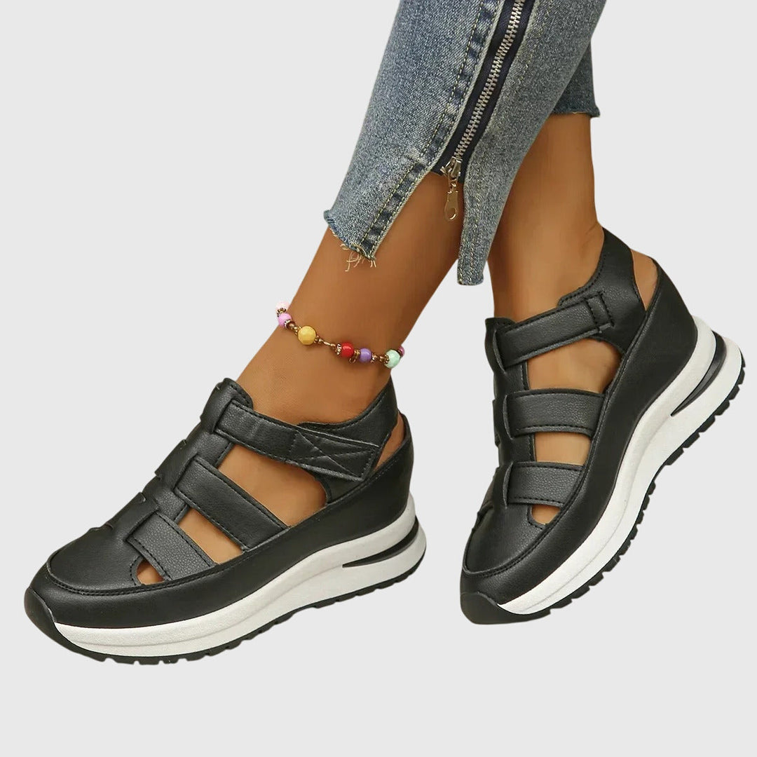 Close-up: Adjustable hook-and-loop straps on women's orthopedic sandals for custom fit & comfort.