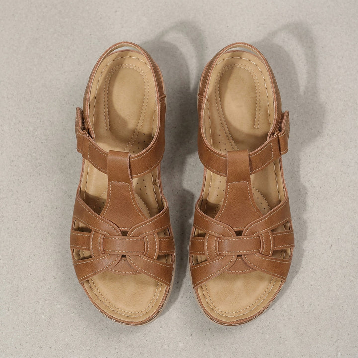 Black orthopedic open-toe sandals for women, offering daily comfort & support.