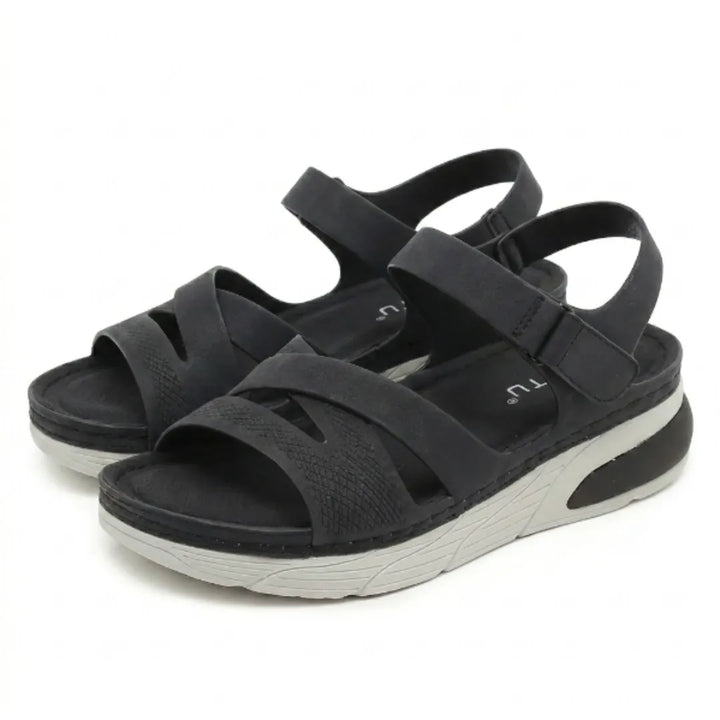 Orthopedic women's arch support sandals for daily wear, adjustable & offering foot relief.