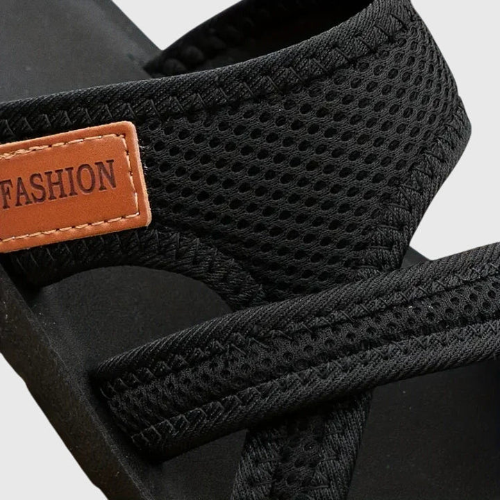 Stylish women's arch support sandals. Elastic strap & cushioned sole for orthopedic comfort & pain relief.