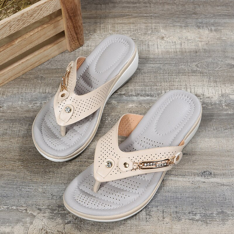 Women's orthopedic comfort sandals with adjustable strap, cushioned footbed, & arch support for foot relief.