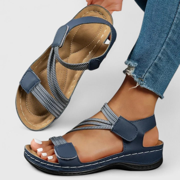 Back view of women's orthopedic summer sandals, emphasizing robust arch support for healthy walking.