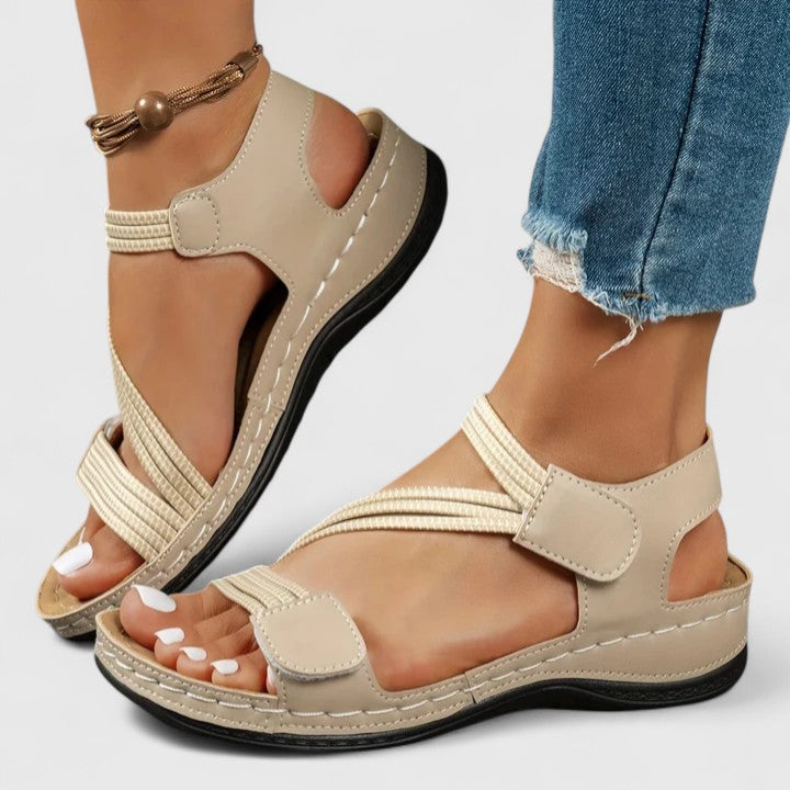 Side view of women's orthopedic sandals, showcasing three-arch support for walking comfort.