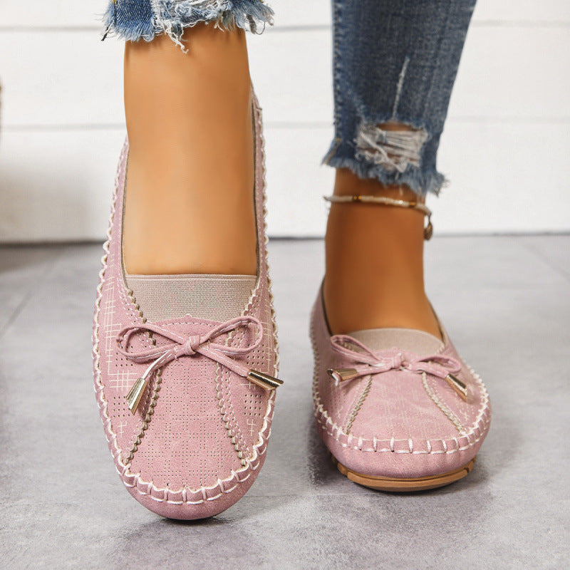 Orthopedic slip-on flats for women, designed for comfort and arch support in a wide fit.