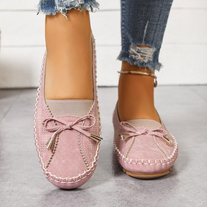 Orthopedic slip-on flats for women, designed for comfort and arch support in a wide fit.