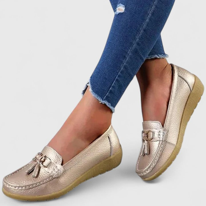 Top view of women's slip-on loafers, highlighting elegant design, moc toe, and orthopedic features.