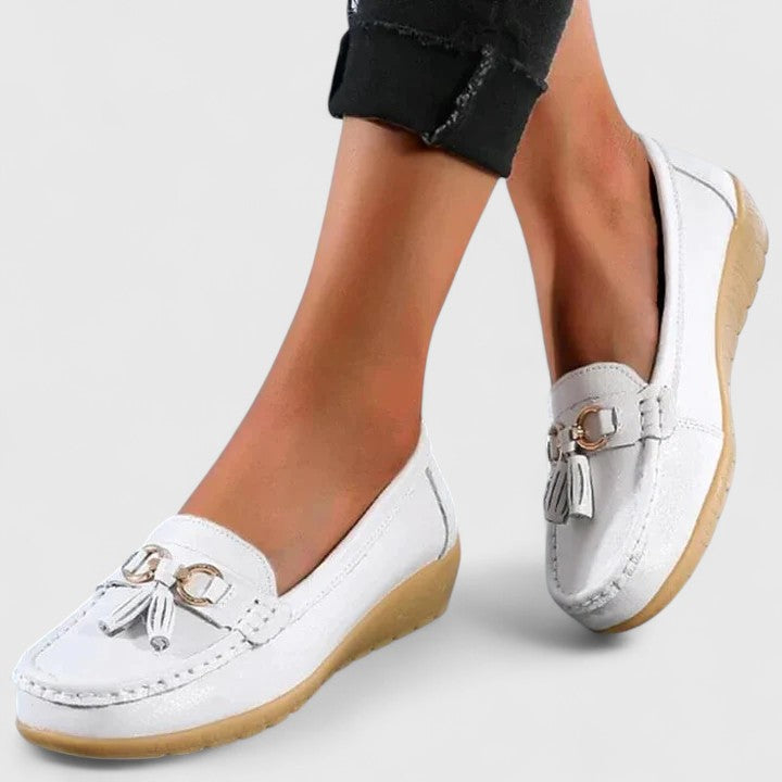 Women's elegant tassel loafers with cushioned insoles, offering orthopedic arch support comfort.