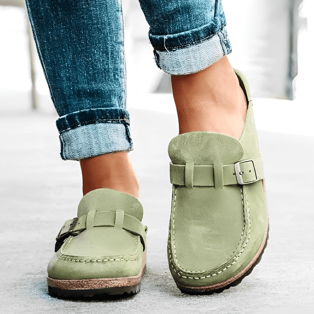 Side view of ergonomic women's orthopedic mules, providing ultimate all-day comfort & supportive slip-on casual design.