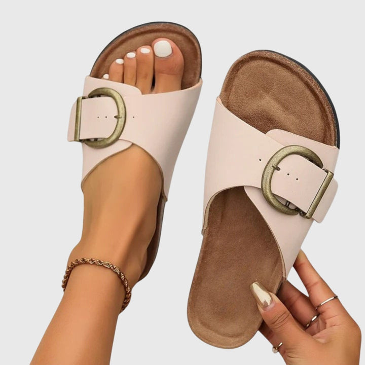 Casual women's slip-on sandals with adjustable strap, open toe, and orthopedic support for beach or daily wear.