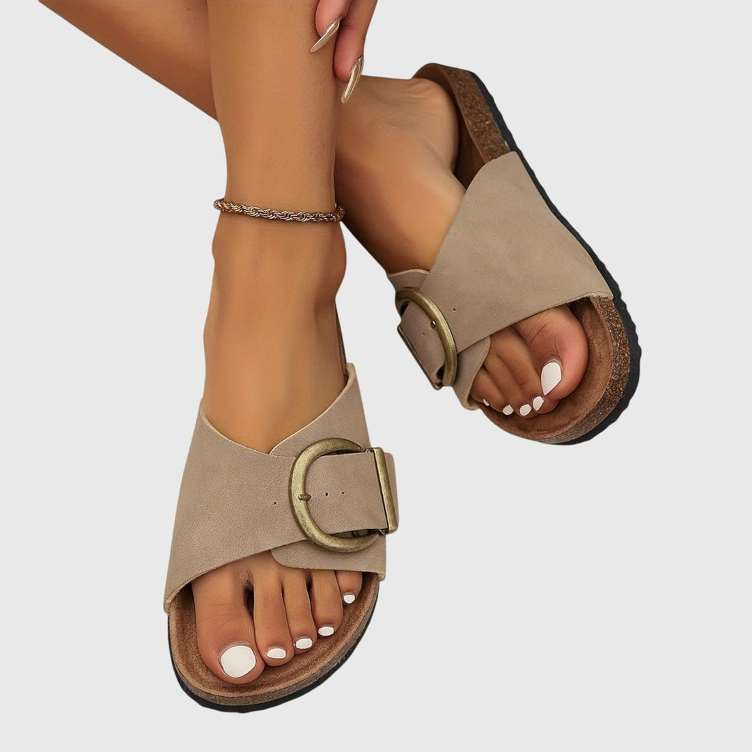 Comfortable women's orthopedic flat sandals. Stylish slip-ons provide foot support for walking & casual summer wear.