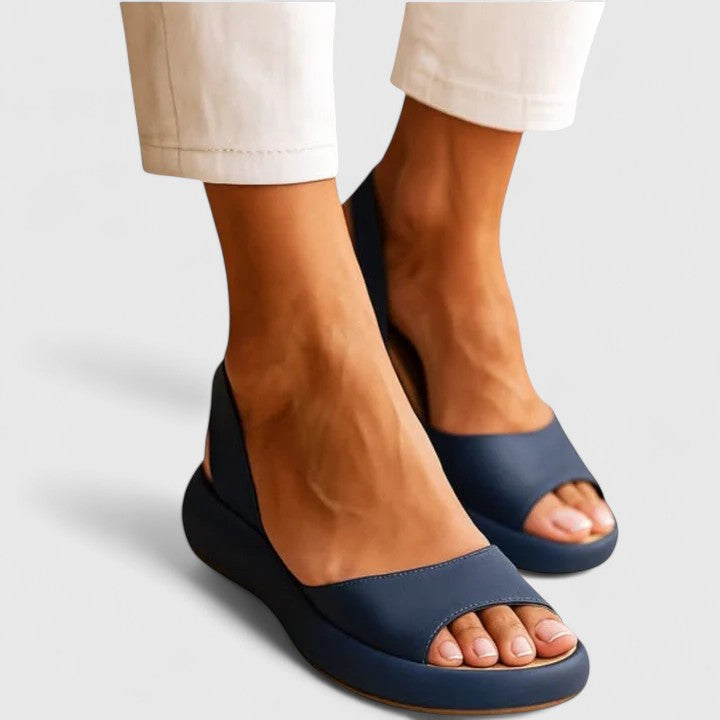 Orthopedic women's slip-on sandals, offering cushioned arch support & shock absorption. Ideal comfort footwear for summer.