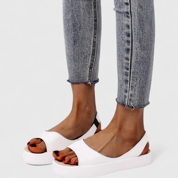Summer-ready women's orthopedic slip-on sandals. Provides arch support & shock absorption for all-day comfort footwear.