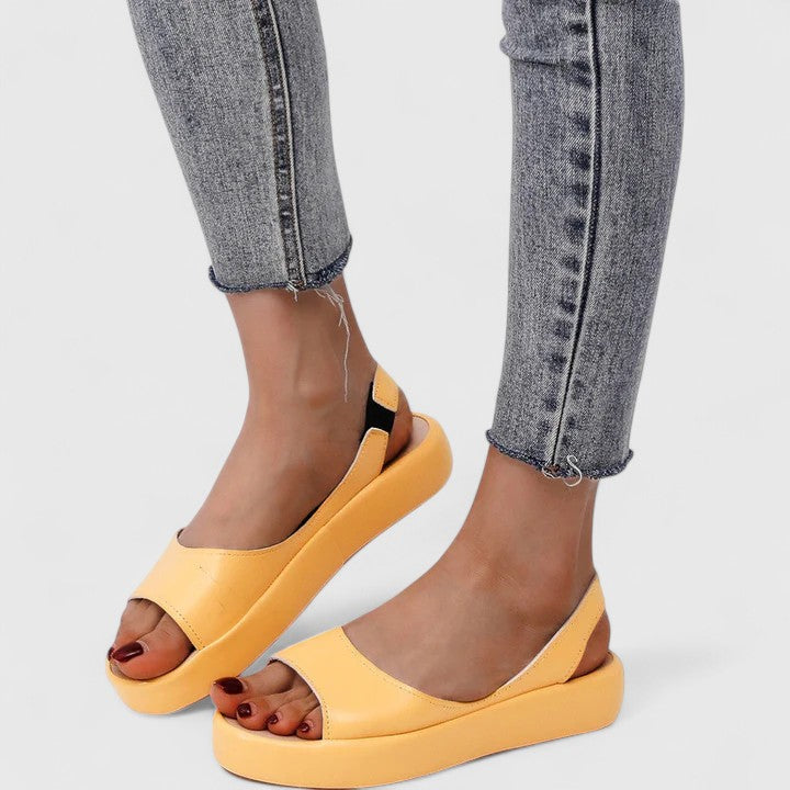 Active women's orthopedic slip-on sandals, engineered for comfort with arch support & shock-absorbing sole. Casual elegance.
