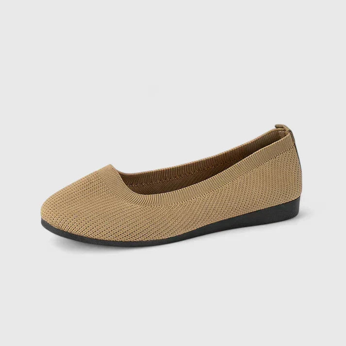 Close-up of a women's orthopedic slip-on shoe, highlighting flexible design & supportive sole for posture.