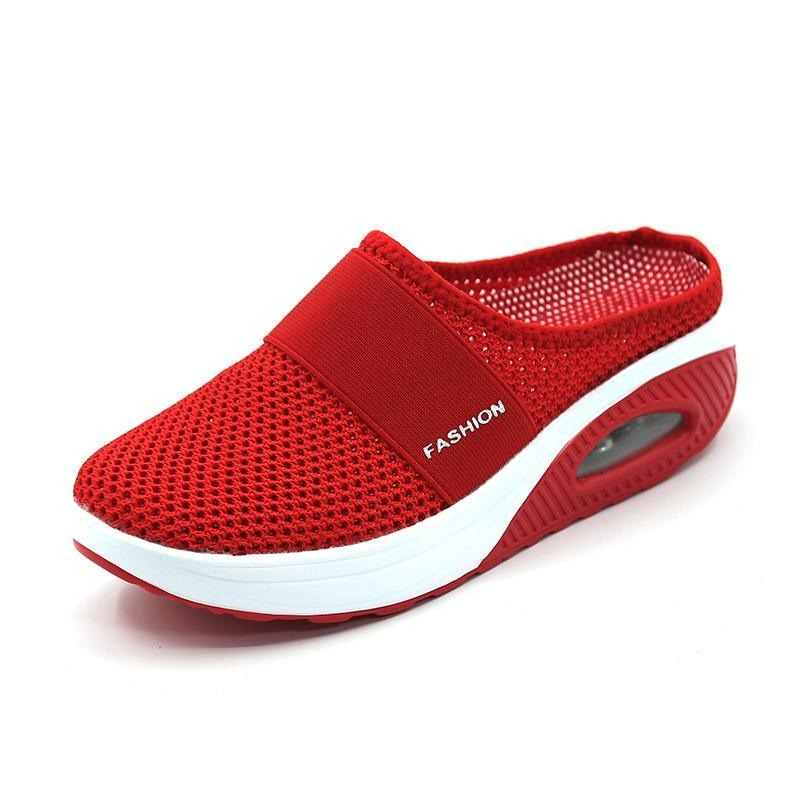 Woman enjoying a walk in supportive women's orthopedic slip-on walking shoes.
