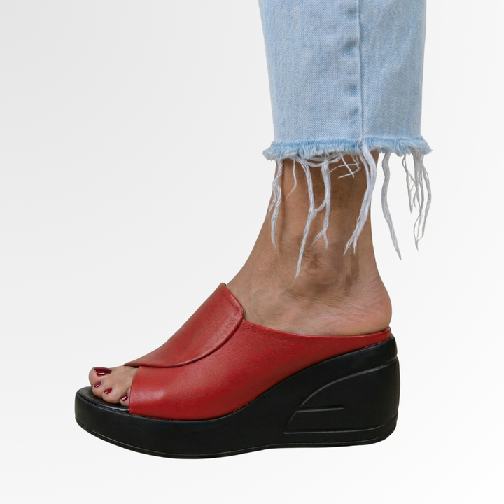 Elegant women's open-toe slip-on wedge sandals. Features orthopedic footbed & all-day comfort for summer footwear.