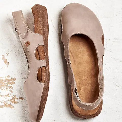 Cushioned women's orthopedic sandals with adjustable straps, providing comfort & support for all-day wear.