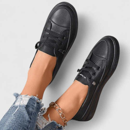 Women's comfortable orthopedic walking shoes in a neutral color, offering lightweight support & arch comfort.