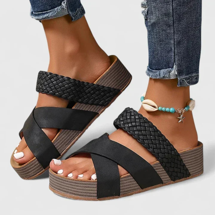 Slip-on women's open-toe wedge platform sandals with woven crossover straps, offering easy wear & supportive comfort.