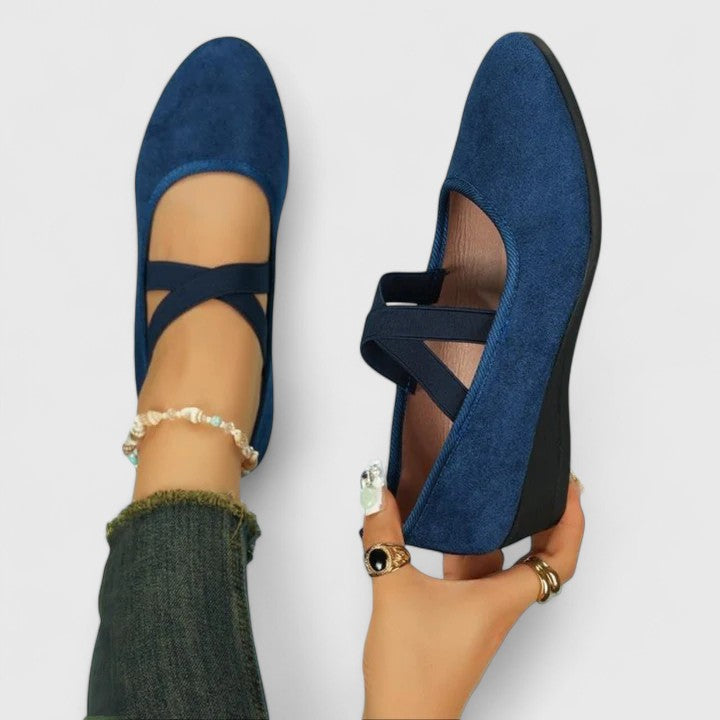 Comfortable women's sandals with a supportive wedge design and easy adjustable straps for all-day wear.