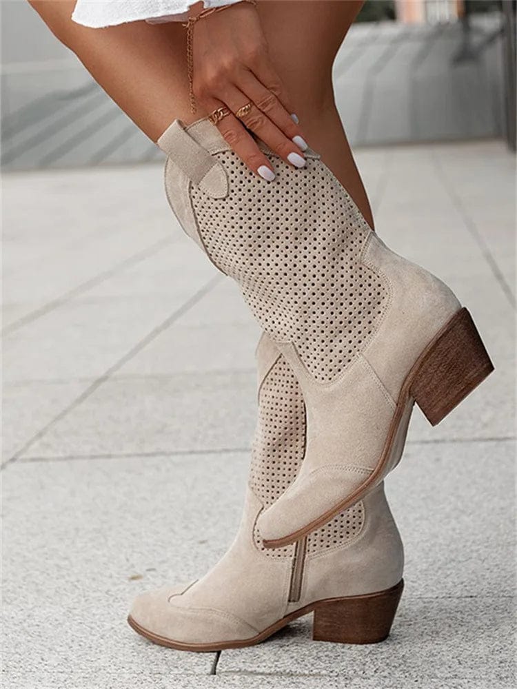 Fashionable women's western boots with a comfortable block heel and orthopedic design.