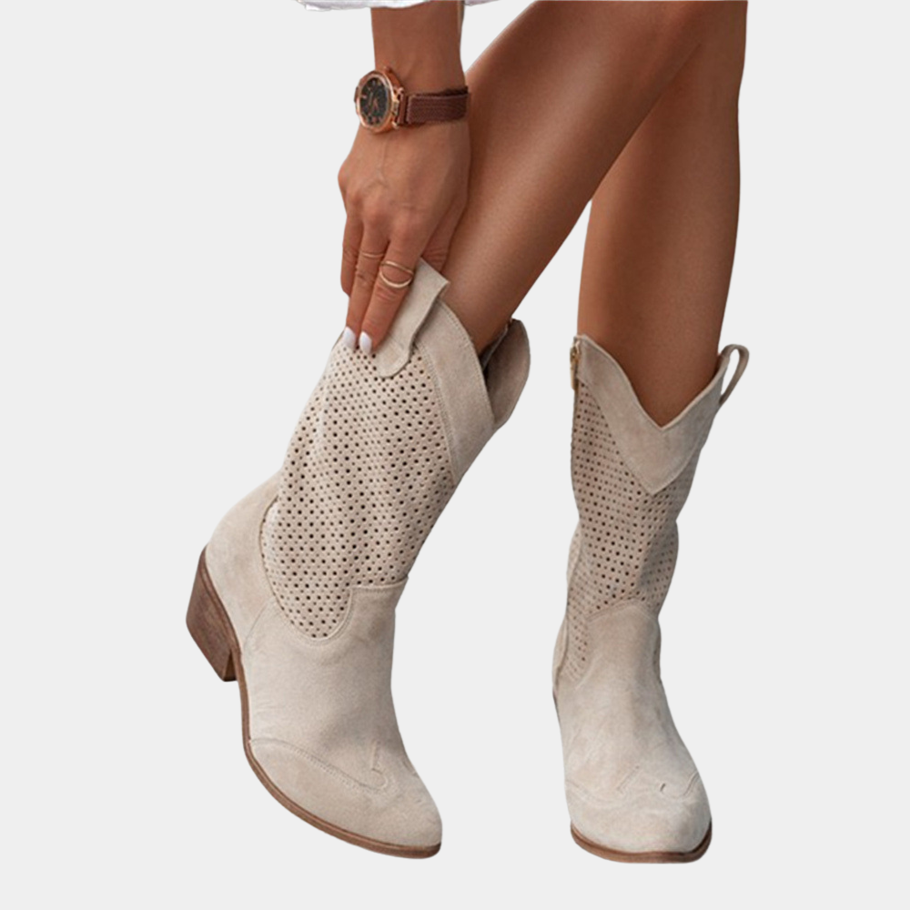Close-up of stylish women's orthopedic cowboy boots, showcasing Western details & all-day comfort features.