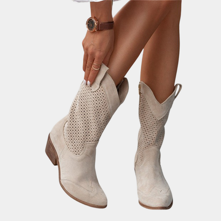 Close-up of stylish women's orthopedic cowboy boots, showcasing Western details & all-day comfort features.