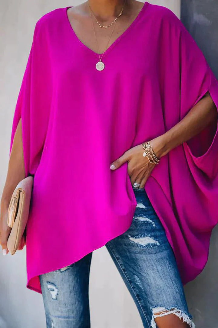 Women's oversized batwing sleeve V-neck tunic top in a relaxed fit, perfect for casual everyday style and comfort.