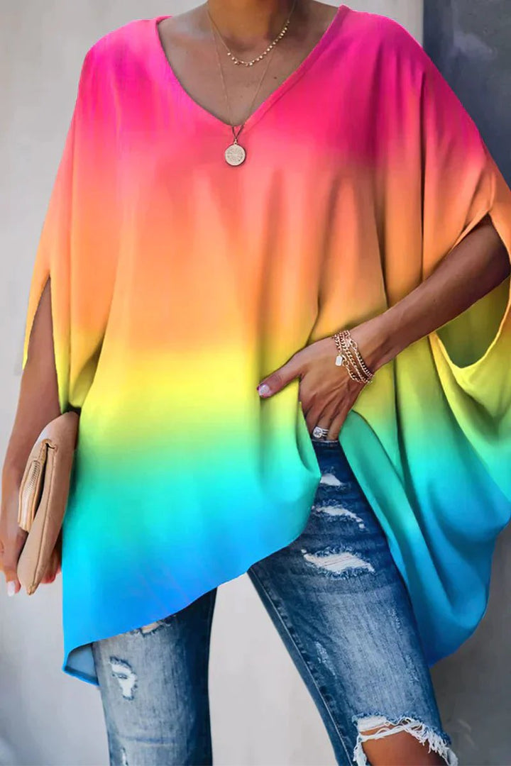 Stylish women's V-neck batwing sleeve tunic top. Loose, comfortable fit for fashion and everyday casual wear.
